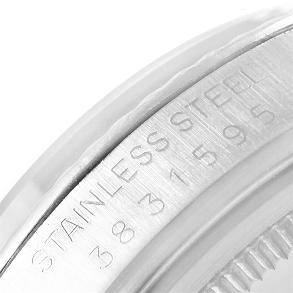 This image shows a close-up of the side casing with engraved text of the Rolex Vintage Collection 1601 Men's Stainless Steel Black Dial 1601 Men's Stainless Steel Black Dial model watch.