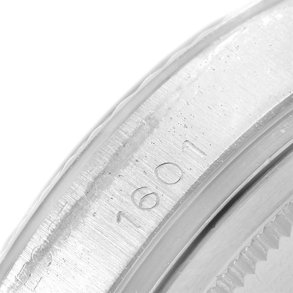 This close-up angle shows the engraved model number "1601" on the bezel of a Rolex Vintage Collection 1601 Men's Stainless Steel Silver Dial 1601 Men's Stainless Steel Silver Dial watch.