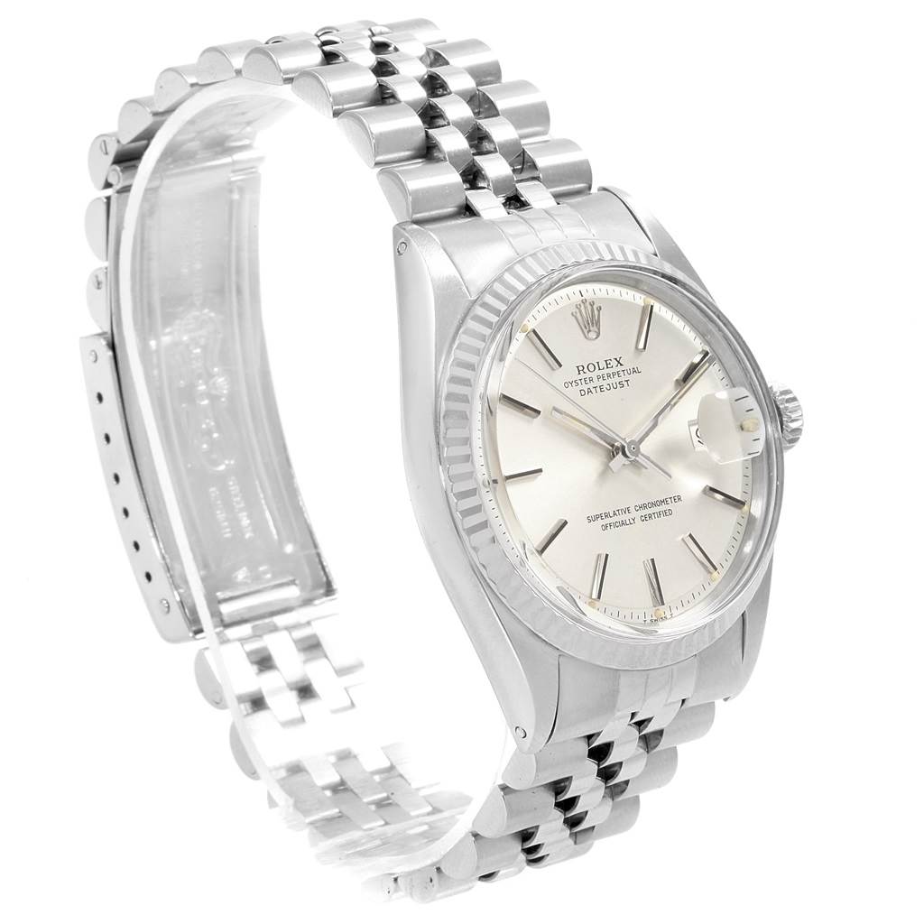 The image shows a Rolex Vintage Collection 1601 Men's Stainless Steel Silver Dial 1601 Men's Stainless Steel Silver Dial model watch, highlighting its face, bezel, and partially opened stainless steel bracelet from an angled view.