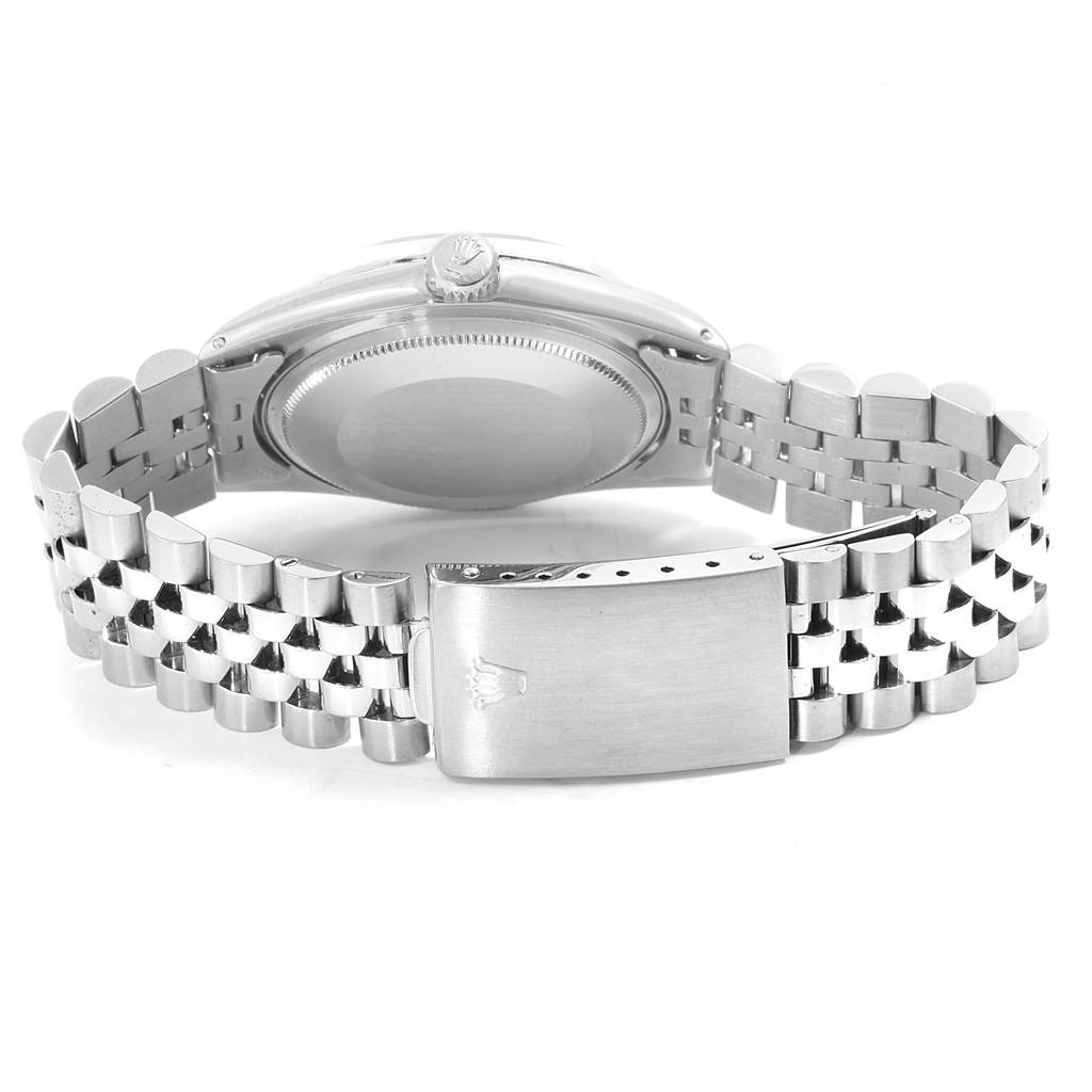 The image shows the back case and bracelet of a Rolex Vintage Collection 1601 Men's Stainless Steel Silver Dial 1601 Men's Stainless Steel Silver Dial model, along with its clasp and crown.