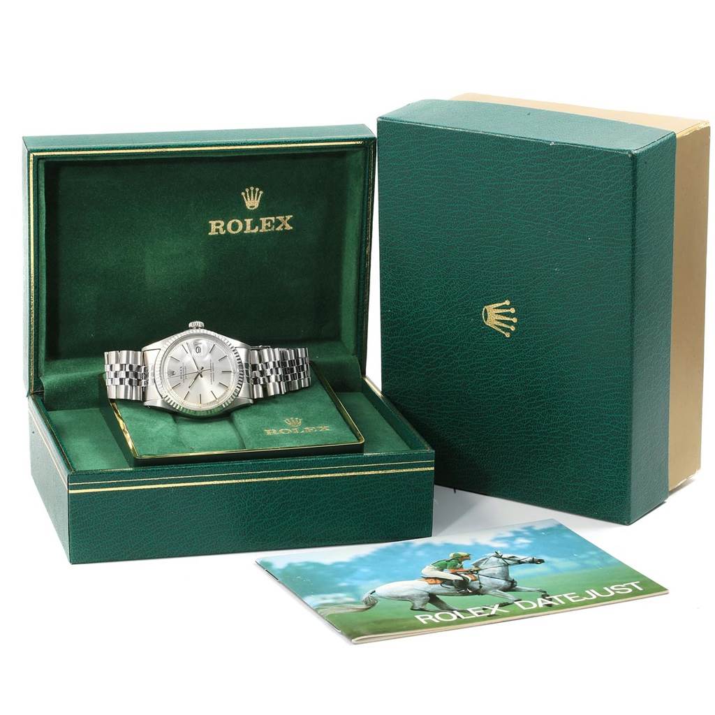 The image displays a Rolex Vintage Collection 1601 Men's Stainless Steel Silver Dial 1601 Men's Stainless Steel Silver Dial model in a green box, accompanied by outer packaging and a booklet titled "Rolex Datejust."