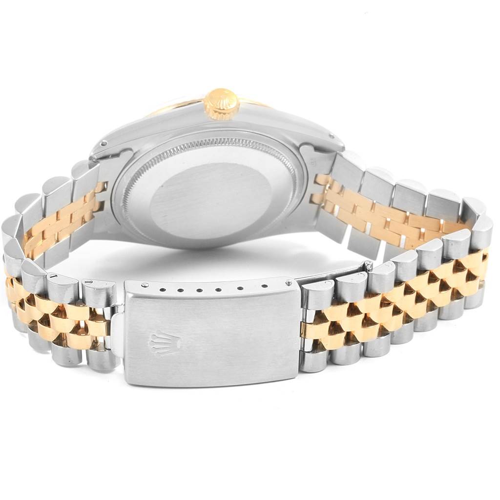 The image shows the back case and bracelet of a Vintage Collection Rolex watch at an angle revealing the clasp and links.