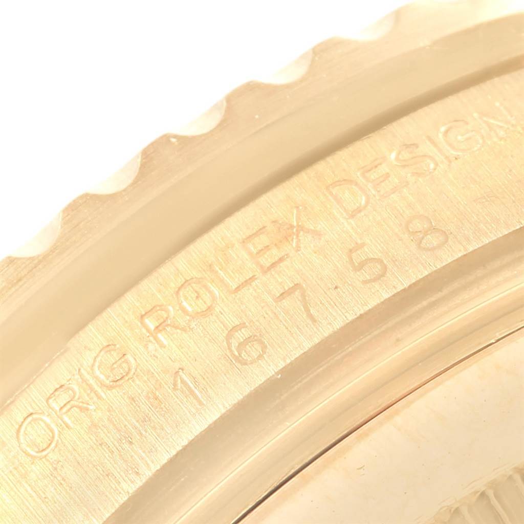 This close-up image of a Vintage Collection Rolex watch shows the engraved bezel from an oblique angle.