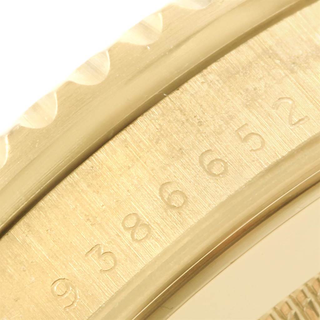 This image shows a close-up of the bezel and part of the dial of a Vintage Collection model by Rolex.
