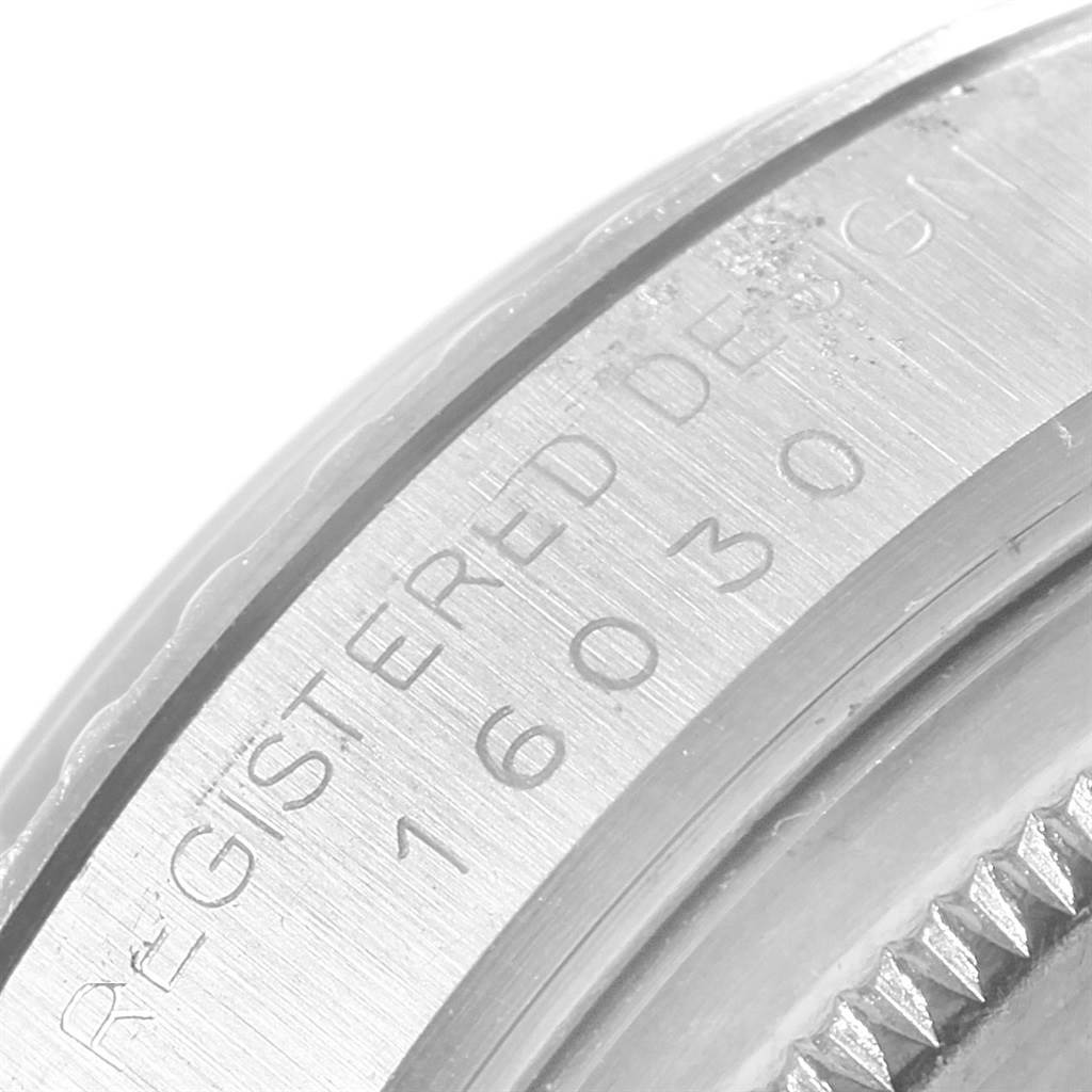 This image shows a close-up of the case side and bezel of the Rolex Vintage Collection 16030 Men
s Stainless Steel Grey Dial 16030 Men
s Stainless Steel Grey Dial model, displaying the engraved "REGISTERED DESIGN 16030."