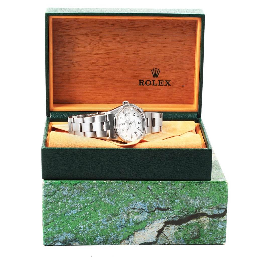 The Rolex Vintage Collection 15010 Men's Stainless Steel White Dial 15010 Men's Stainless Steel White Dial watch is displayed inside an open green and wooden box, showing the face and bracelet of the watch.