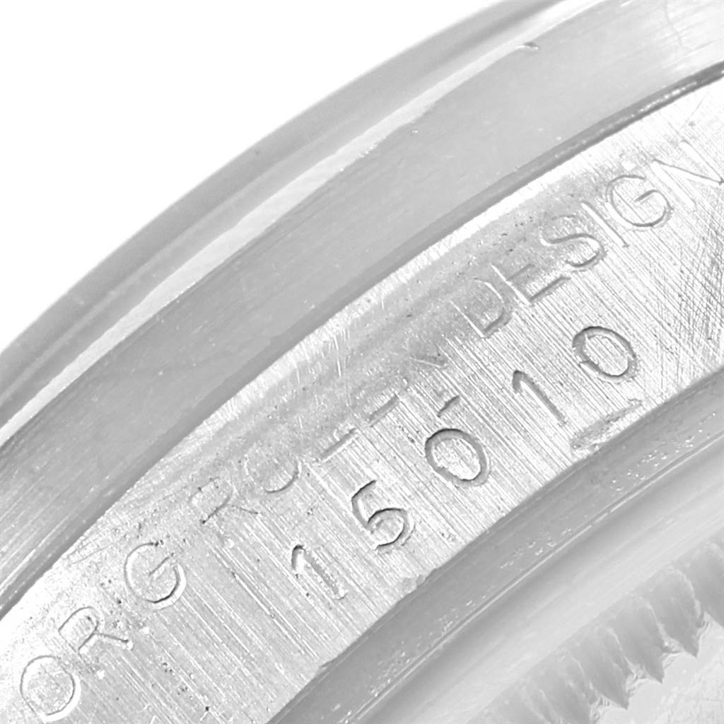 This image shows a close-up of the engraved serial number on the case of a Rolex Vintage Collection 15010 Men's Stainless Steel White Dial 15010 Men's Stainless Steel White Dial watch.