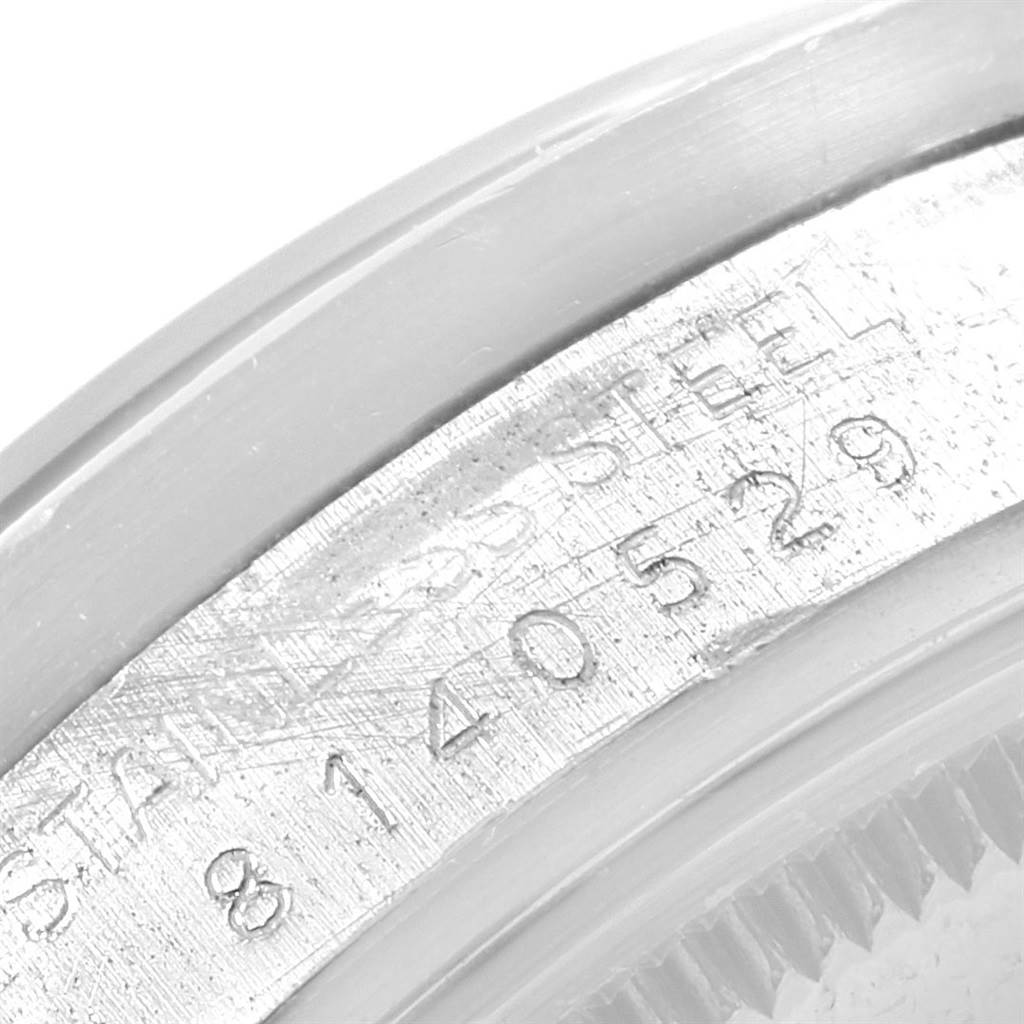 This is a close-up angle showing the serial number on the Rolex Vintage Collection 15010 Men's Stainless Steel White Dial 15010 Men's Stainless Steel White Dial model's stainless steel case.