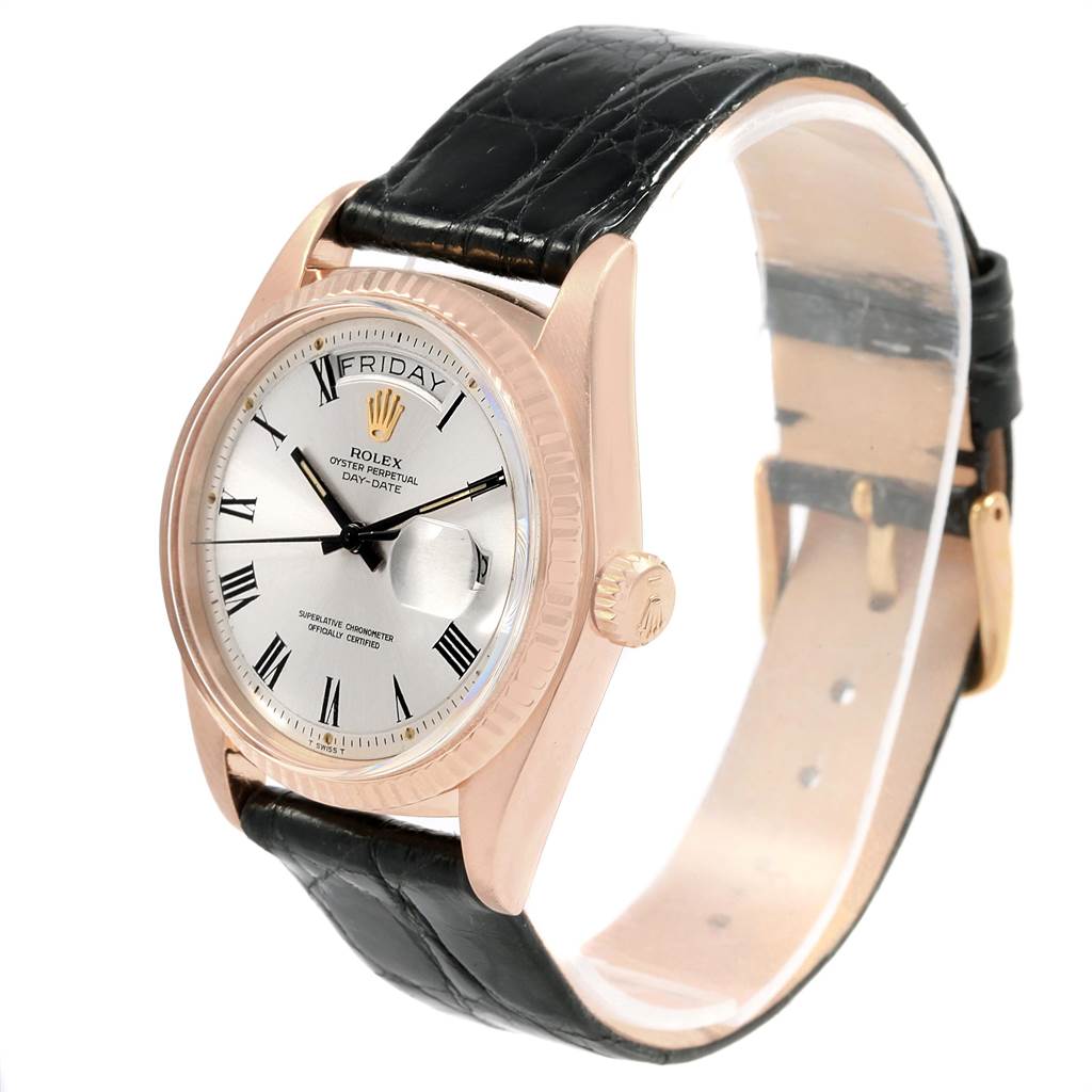 This image shows a Rolex Vintage Collection 1803 Men's Rose Gold Silver Dial 1803 Men's Rose Gold Silver Dial watch at an oblique angle, highlighting the face, crown, and black leather strap.