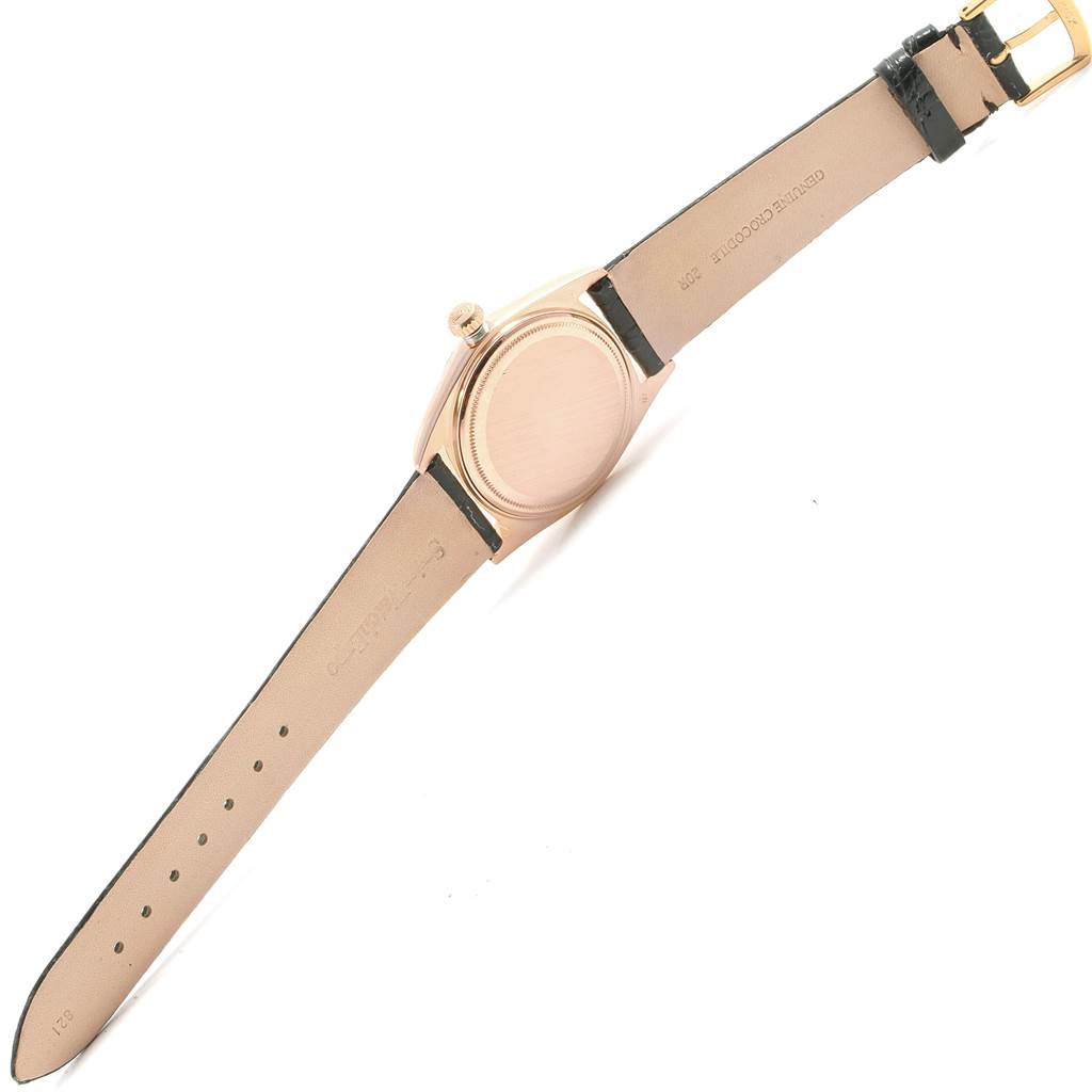 The image shows the back view of a Vintage Collection model by Rolex, highlighting the strap and case back.