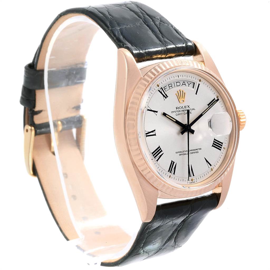 The image displays a Rolex Vintage Collection 1803 Men's Rose Gold Silver Dial 1803 Men's Rose Gold Silver Dial model watch at a three-quarter angle, showing its dial, bezel, crown, and black leather strap.