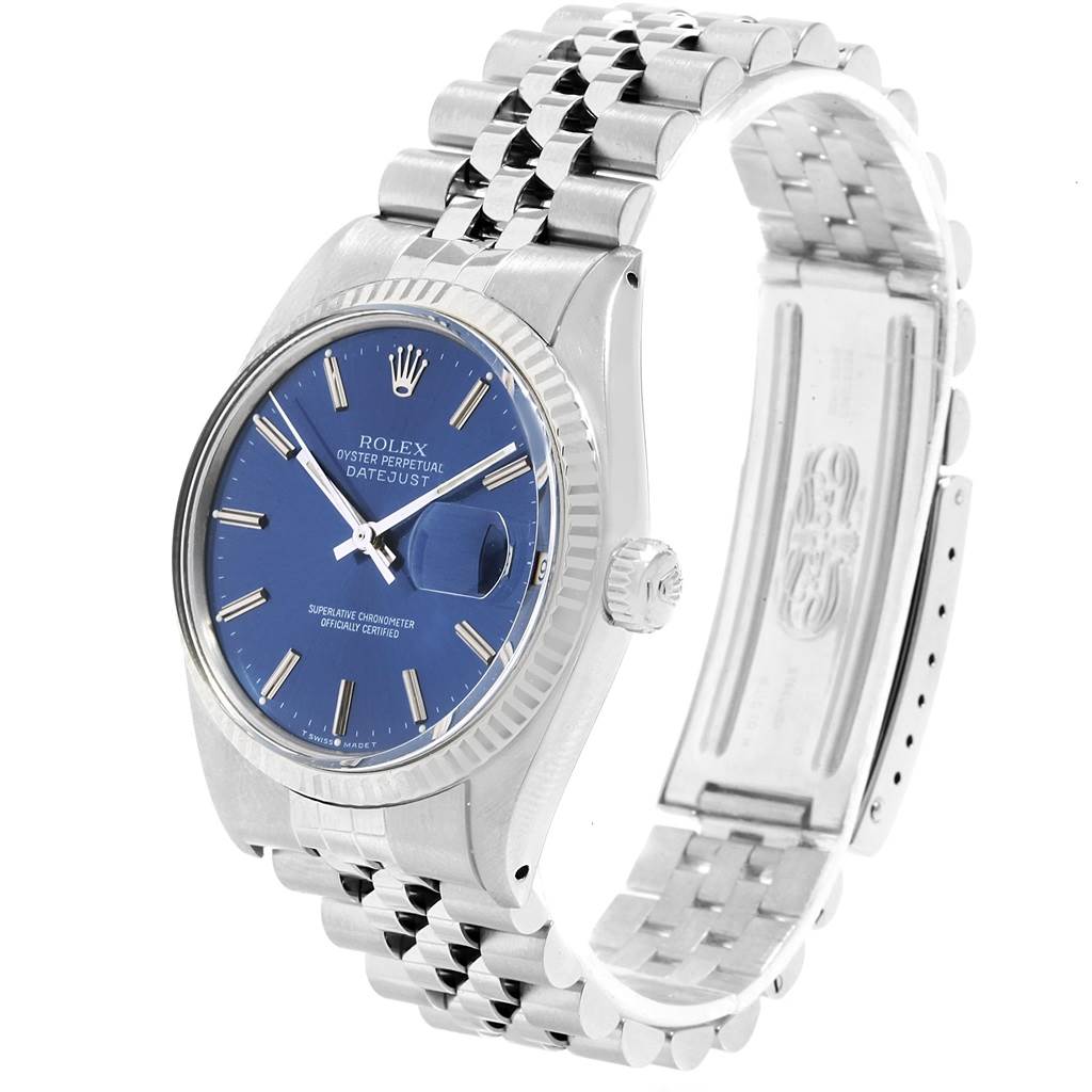 The image shows a Rolex Vintage Collection 16014 Men's Stainless Steel Blue Dial 16014 Men's Stainless Steel Blue Dial Datejust watch at a three-quarter angle, highlighting its blue dial, fluted bezel, and stainless steel bracelet.