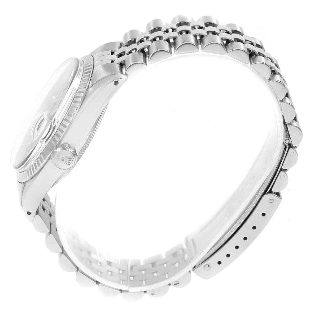 The image shows a side angle of the Rolex Vintage Collection 16014 Men's Stainless Steel Blue Dial 16014 Men's Stainless Steel Blue Dial watch, highlighting its bracelet, case, and crown.