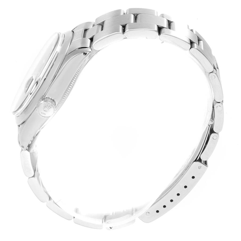 The image shows a side view of the Rolex Vintage Collection 1500 Men's Stainless Steel Black Dial 1500 Men's Stainless Steel Black Dial watch, highlighting the bracelet, clasp, and crown.