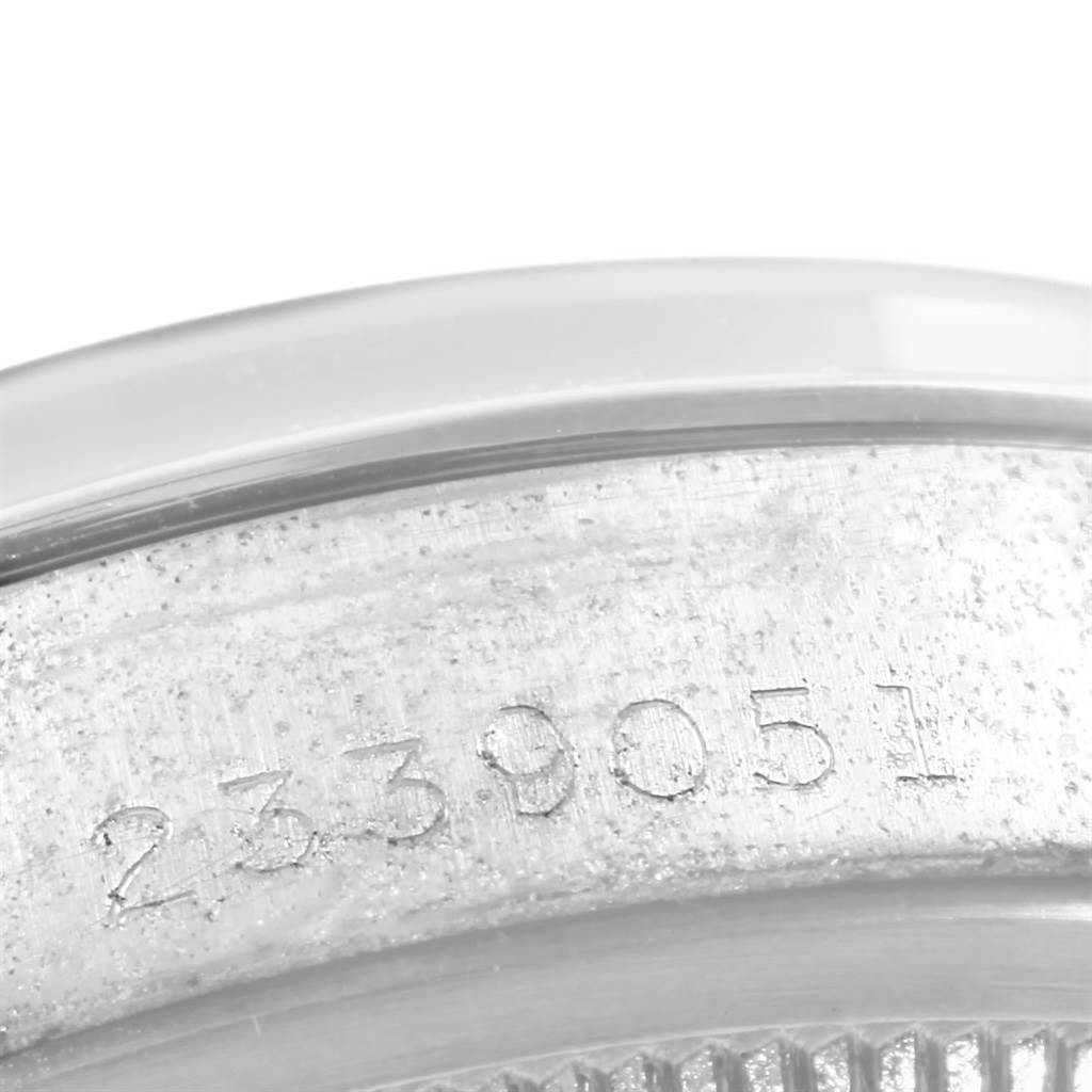 The image shows a close-up view of the serial number engraved on the side of the Vintage Collection watch case by Rolex.