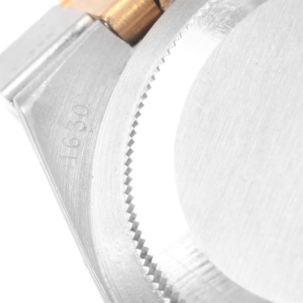 The close-up angle shows the case and bezel of a Rolex Vintage Collection 1630 Men's Steel and Gold (two tone) Champagne Dial 1630 Men's Steel and Gold (two tone) Champagne Dial watch, including part of the serial number.