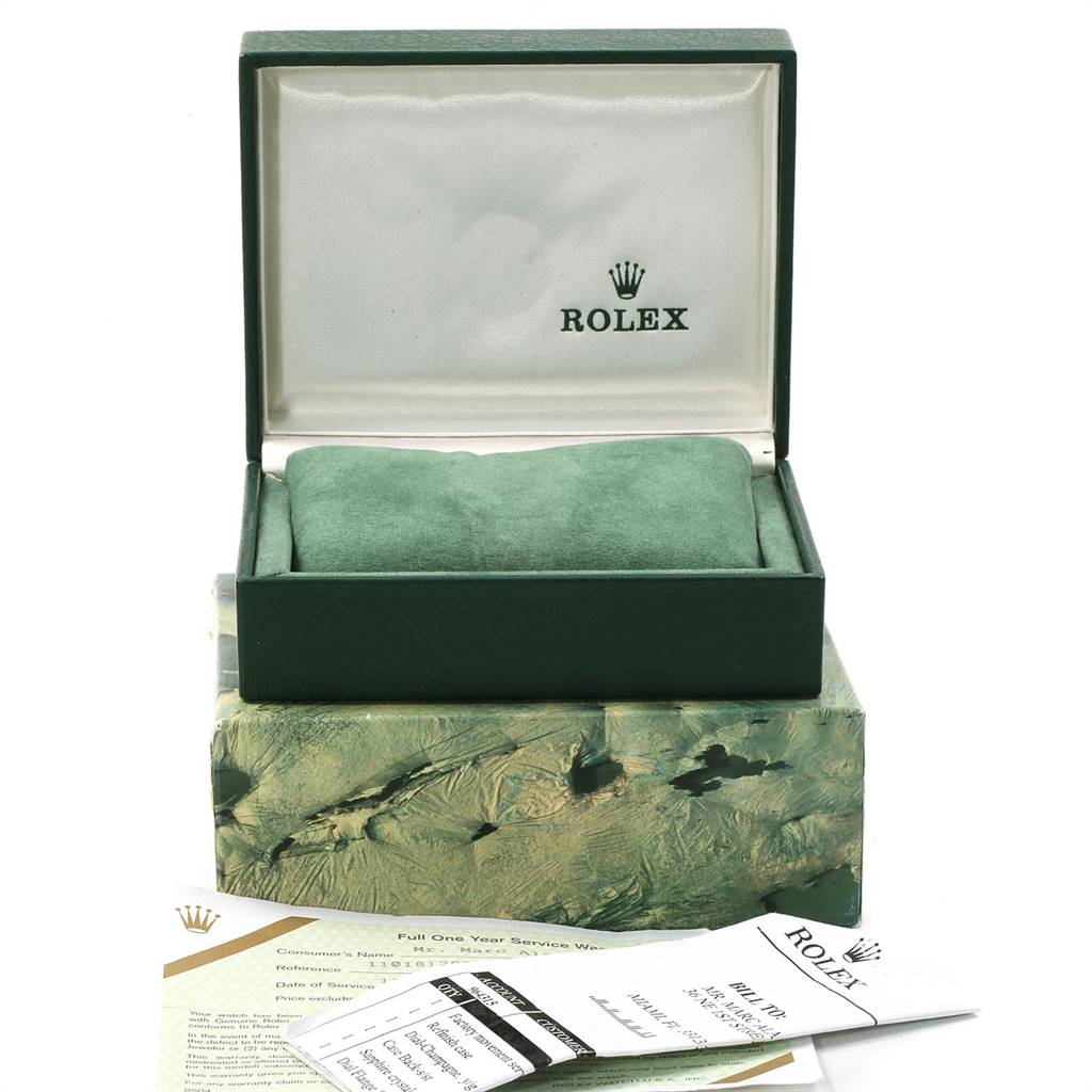 The image shows the Rolex Vintage Collection 1630 Men's Steel and Gold (two tone) Champagne Dial 1630 Men's Steel and Gold (two tone) Champagne Dial watch box, cushion, and accompanying warranty and information cards.