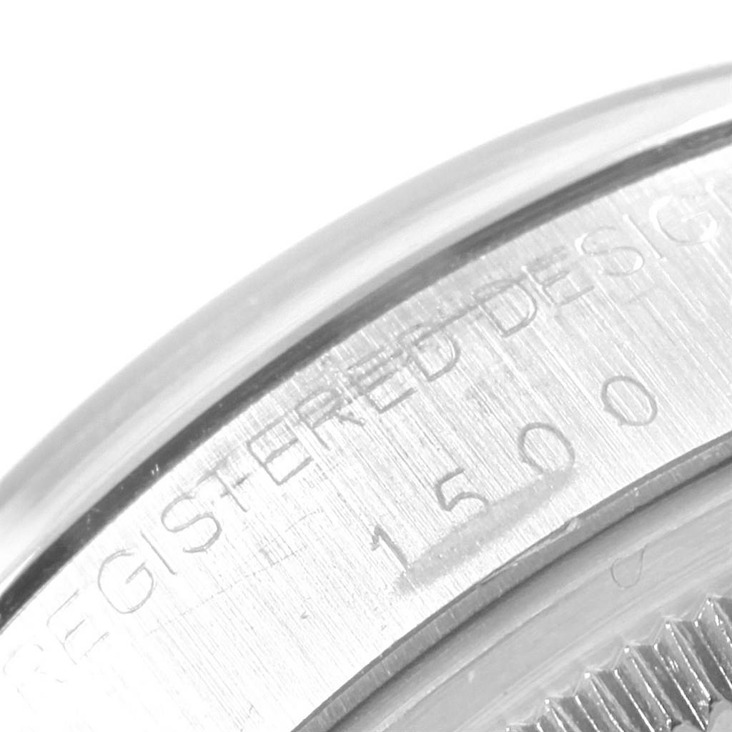 This is a close-up angle showing the side engraving of the Rolex Vintage Collection 1500 Men's Stainless Steel Silver Dial 1500 Men's Stainless Steel Silver Dial model watch, including the serial number.