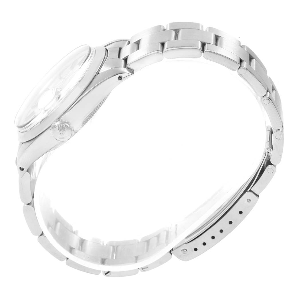 This image shows a side view of the Rolex Vintage Collection 1500 Men's Stainless Steel Silver Dial 1500 Men's Stainless Steel Silver Dial watch, highlighting its case, crown, and bracelet.