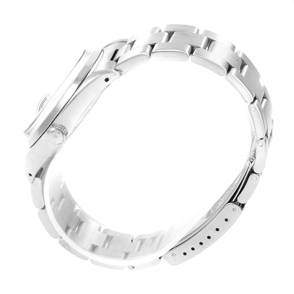 This image shows a side angle of the Rolex Vintage Collection 6694 Men's Stainless Steel White Dial 6694 Men's Stainless Steel White Dial watch, focusing on its crown, case, and bracelet.