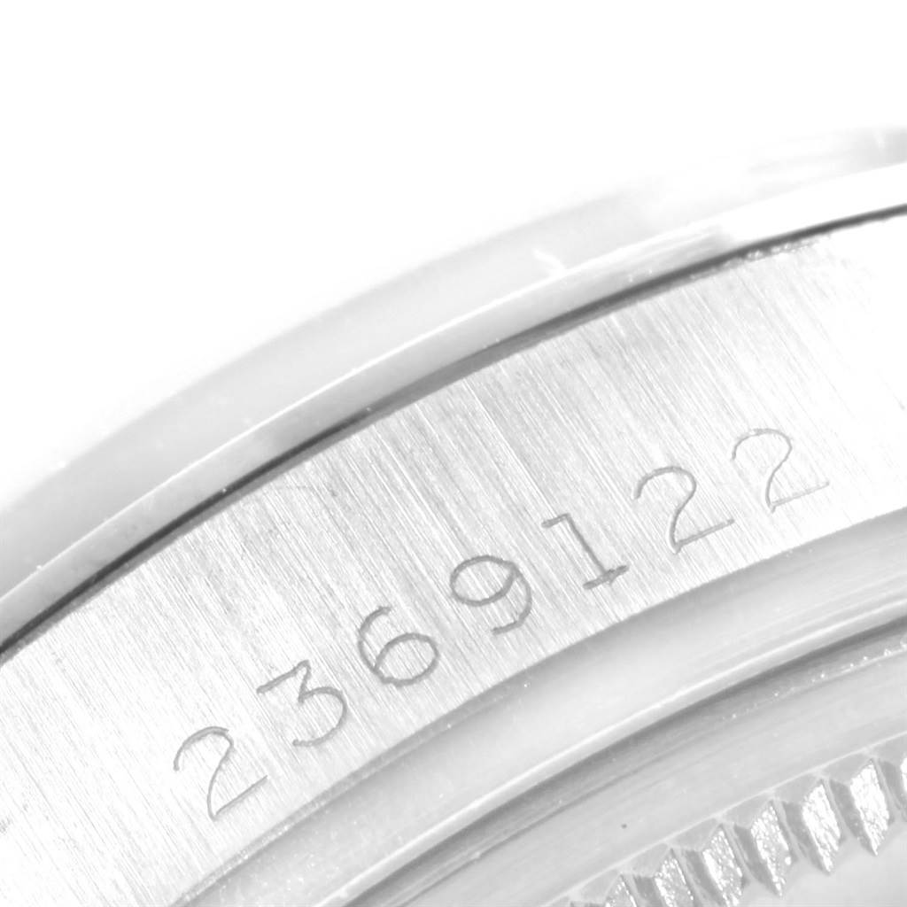 This close-up image shows the engraved serial number on the side case of a Rolex Vintage Collection 1600 Men's Stainless Steel Silver Dial 1600 Men's Stainless Steel Silver Dial watch.