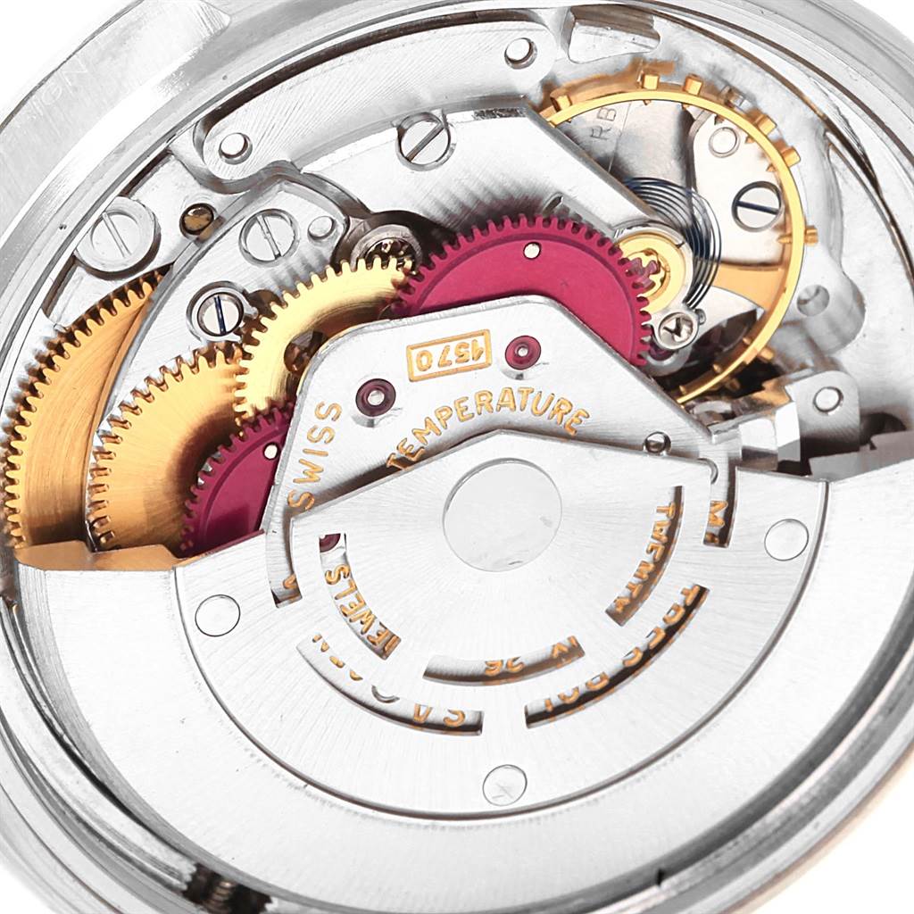 This image shows a close-up view of the intricate mechanical movement inside a Rolex Vintage Collection 1600 Men's Stainless Steel Silver Dial 1600 Men's Stainless Steel Silver Dial watch.
