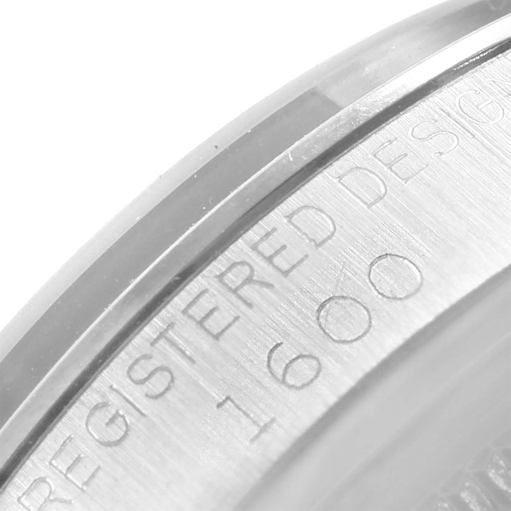 This close-up image shows the side engraving of the Rolex Vintage Collection 1600 Men's Stainless Steel Silver Dial 1600 Men's Stainless Steel Silver Dial model with part of its serial number visible.
