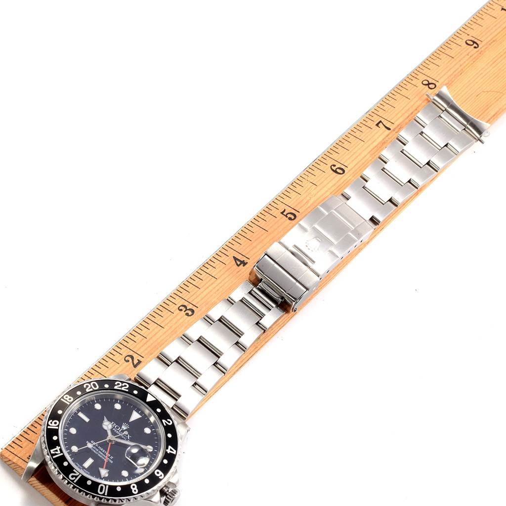 The image shows a Vintage Collection Rolex watch laid flat with the band extended, next to a ruler for measurement.