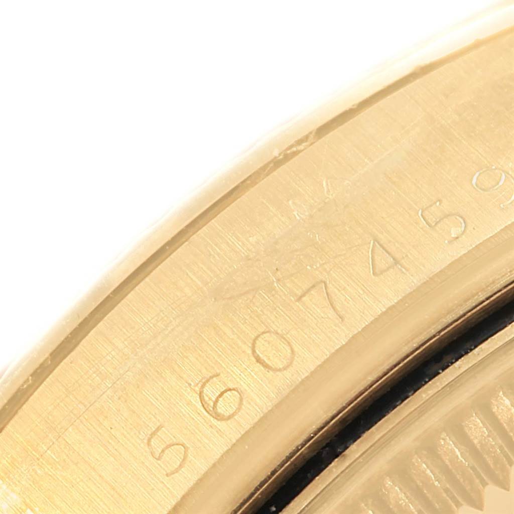 This image shows a close-up view of the case edge with engraved numbers on a Rolex Vintage Collection 1503 Men's Yellow Gold Silver Dial 1503 Men's Yellow Gold Silver Dial watch.