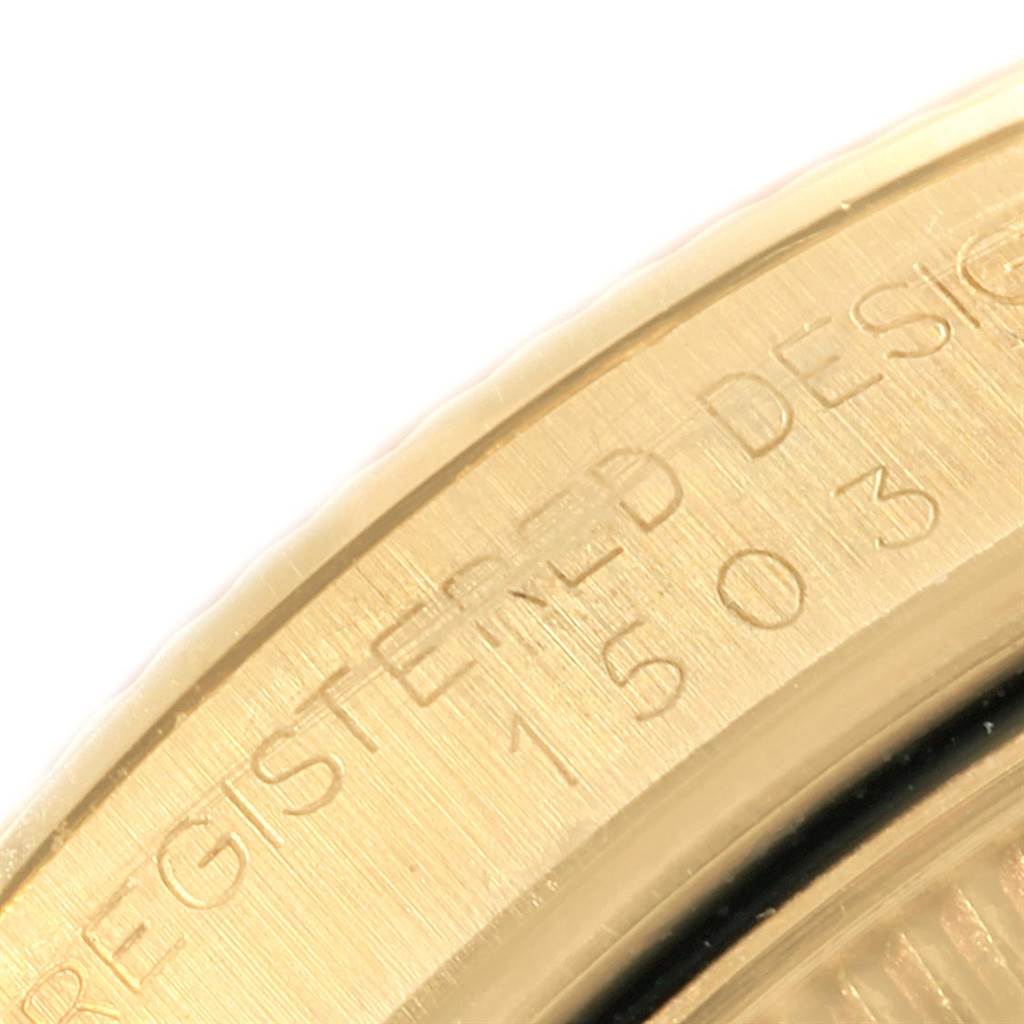 This close-up image shows a portion of the engraved case back of the Rolex Vintage Collection 1503 Men's Yellow Gold Silver Dial 1503 Men's Yellow Gold Silver Dial watch.
