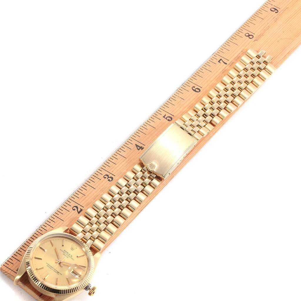 The image shows a top view of a Rolex Vintage Collection 1503 Men's Yellow Gold Champagne Dial 1503 Men's Yellow Gold Champagne Dial watch, highlighting the watch face, bracelet, and clasp on a ruler.