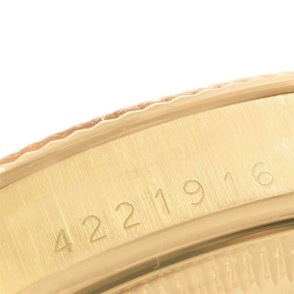 The image shows a close-up of the serial number engraved on the case of a Vintage Collection model by Rolex.