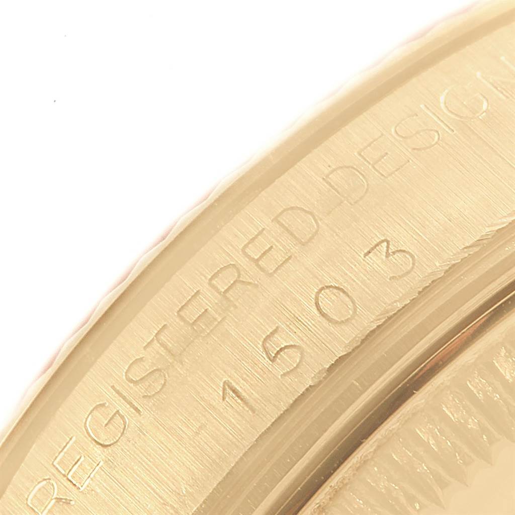 This image shows a close-up of the edge of the bezel with engraved text on a Rolex Vintage Collection 1503 Men's Yellow Gold Champagne Dial 1503 Men's Yellow Gold Champagne Dial watch.