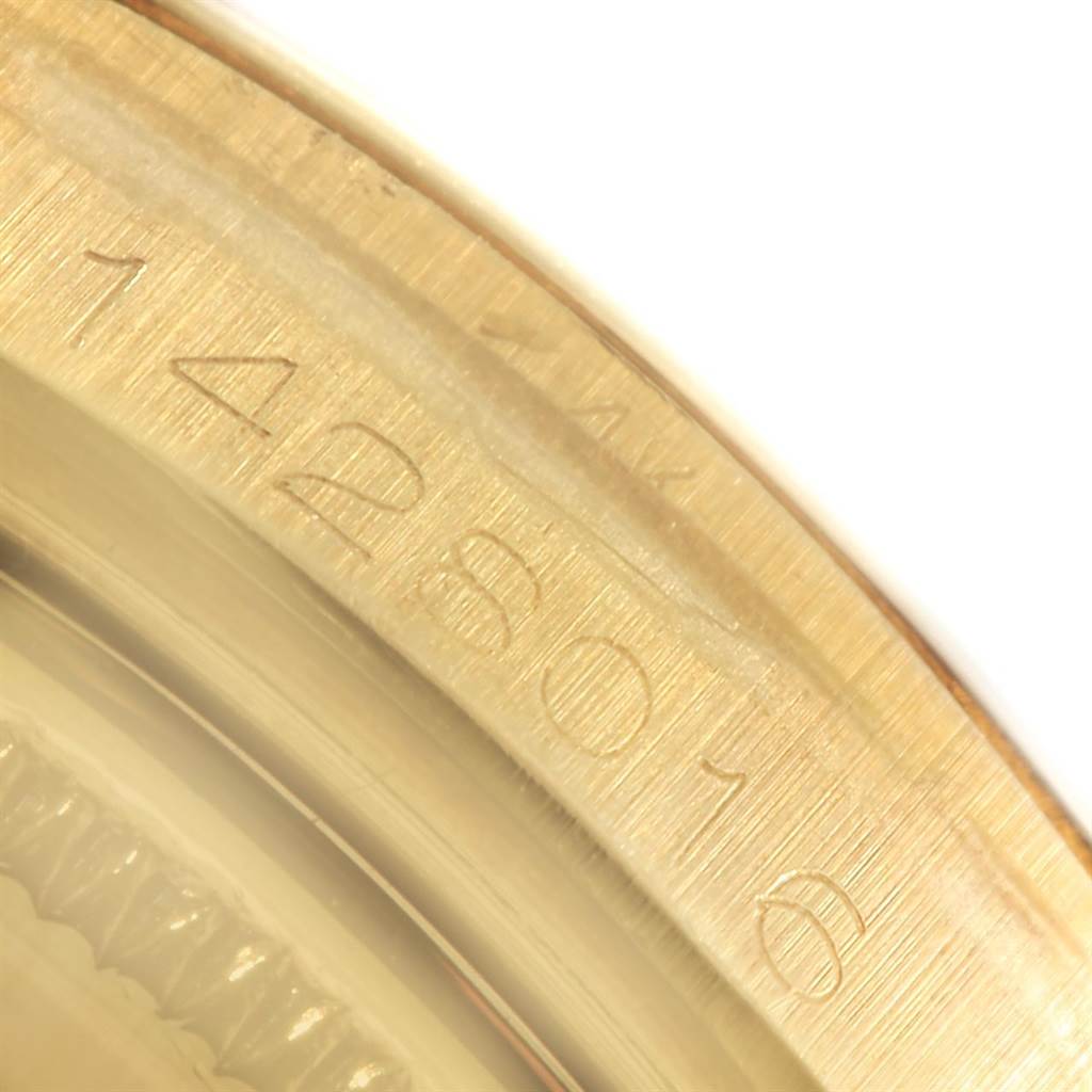 This is a close-up angle showing the engraved serial number on the case of a Vintage Collection model by Rolex.
