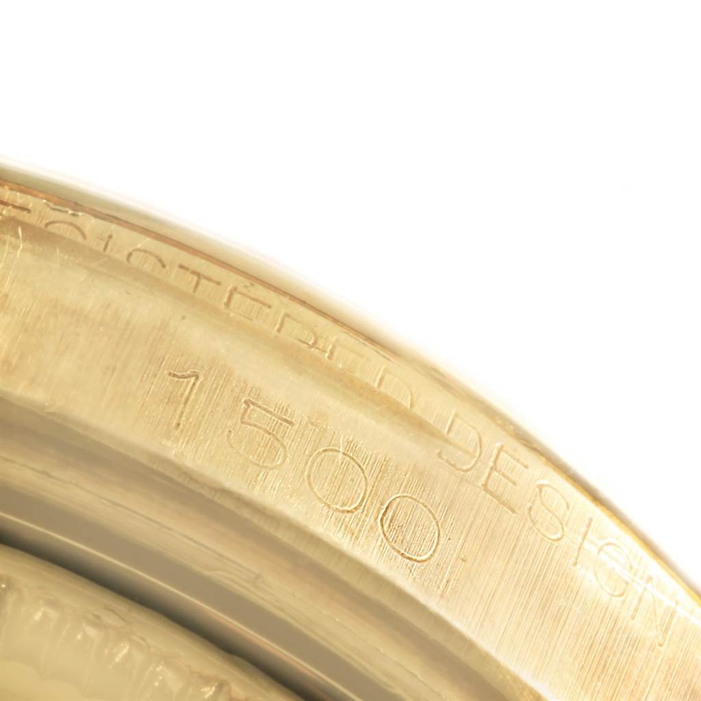 The image shows the engraved side part of a Vintage Collection Rolex watch case at a close-up angle.