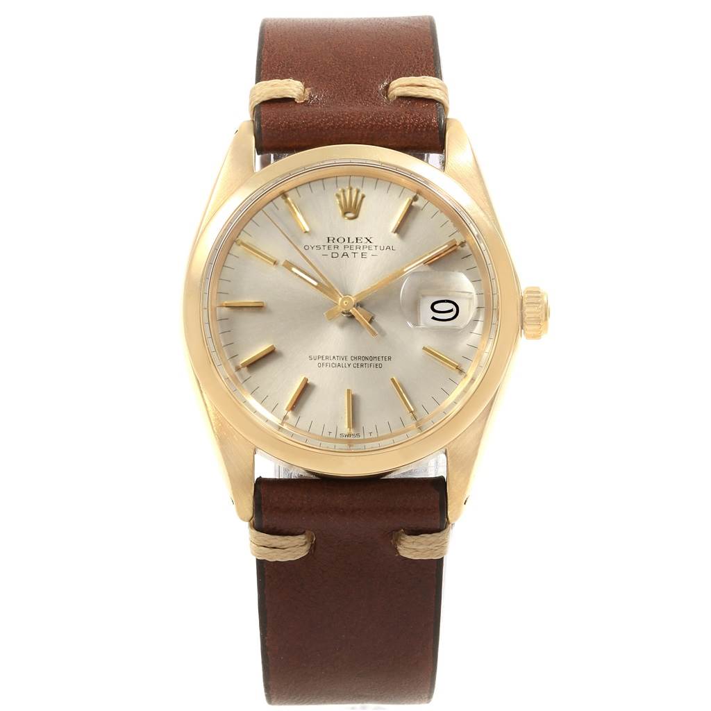 This is a front angle view of a Rolex Vintage Collection 1500 Men's Yellow Gold Silver Dial 1500 Men's Yellow Gold Silver Dial Oyster Perpetual Date watch, showcasing its dial, case, and leather strap.