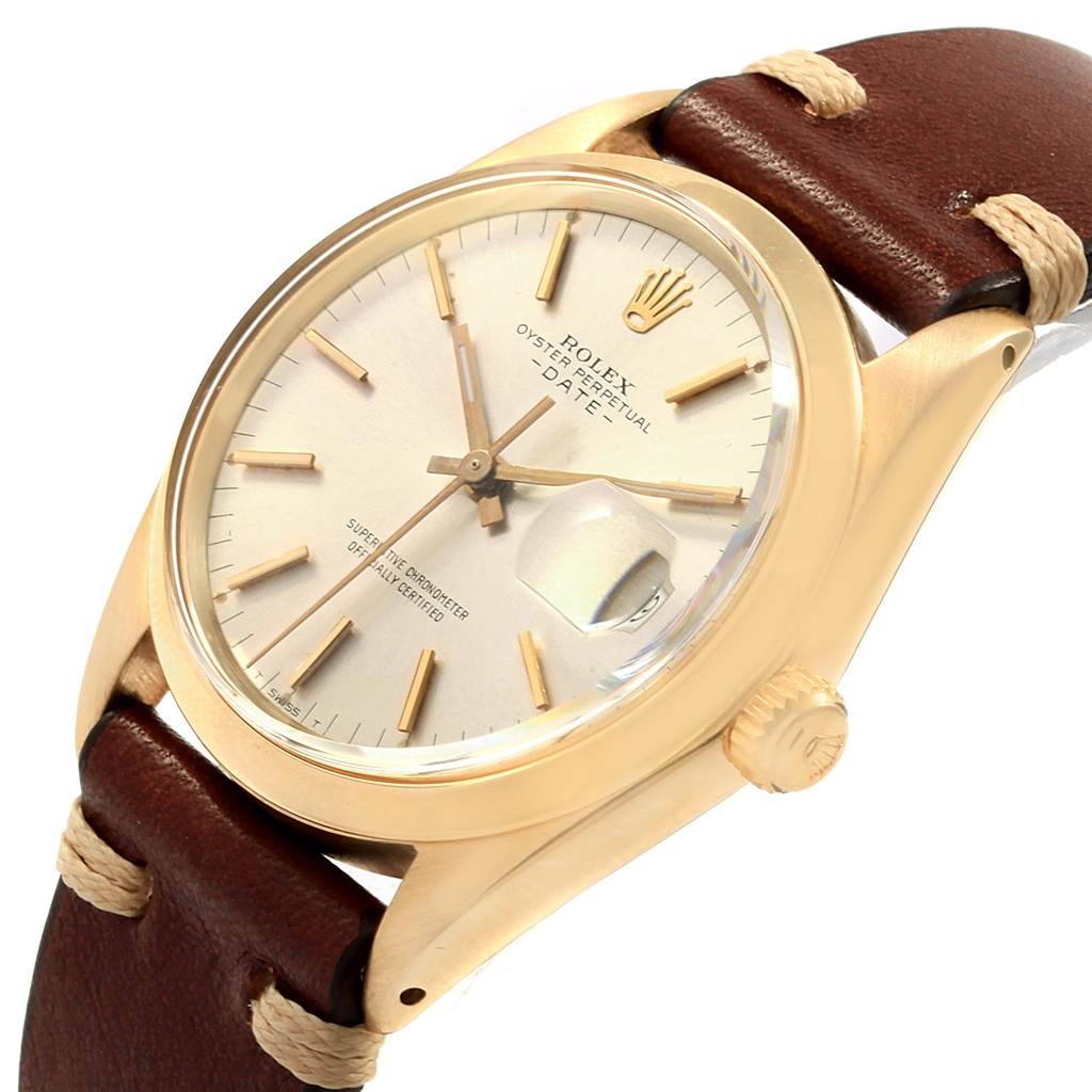 The Rolex Vintage Collection 1500 Men's Yellow Gold Silver Dial 1500 Men's Yellow Gold Silver Dial watch is shown at a slight angle, displaying the face, bezel, crown, and part of the leather strap.