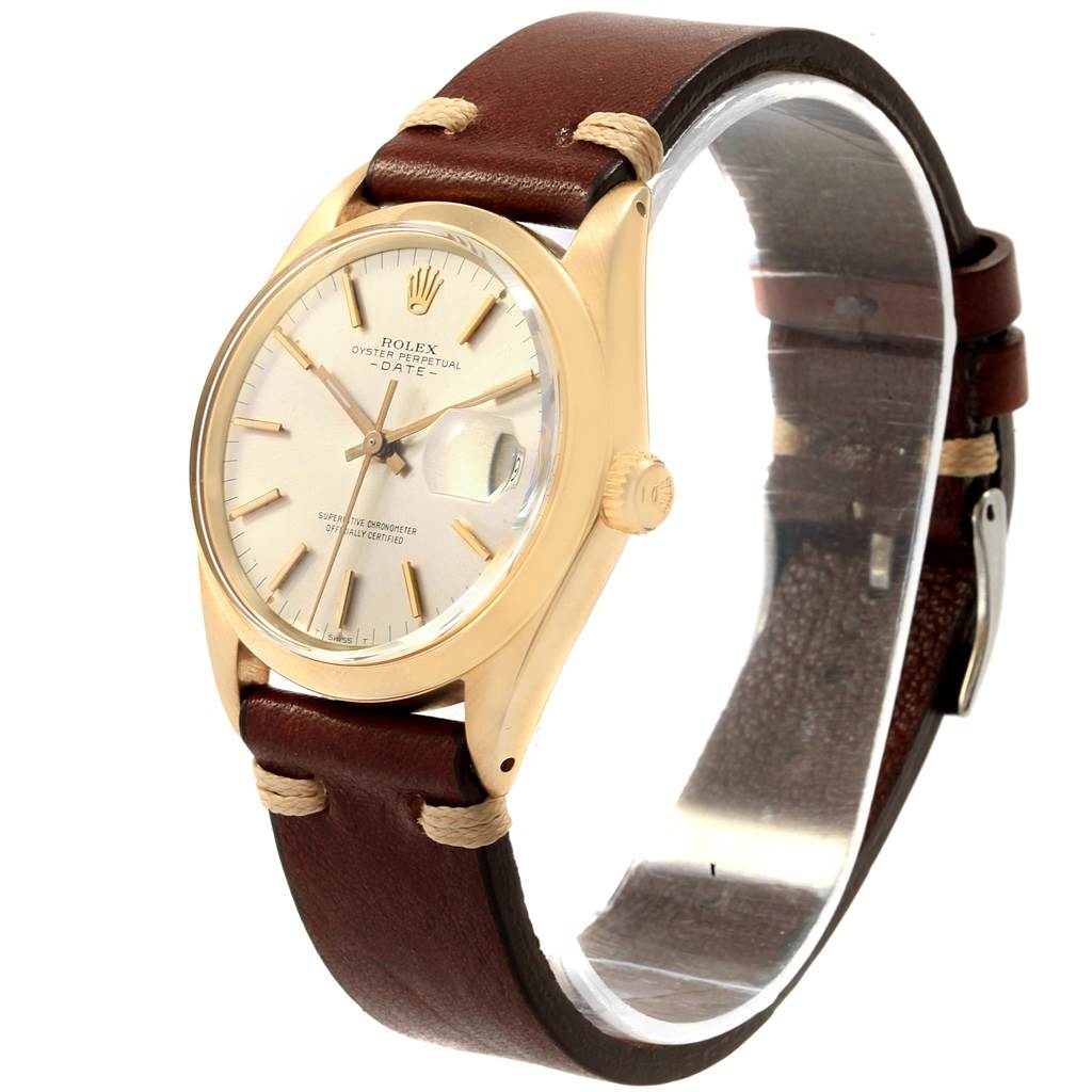 The image shows a Rolex Vintage Collection 1500 Men's Yellow Gold Silver Dial 1500 Men's Yellow Gold Silver Dial watch at a three-quarter angle, highlighting its face, case, and leather strap.