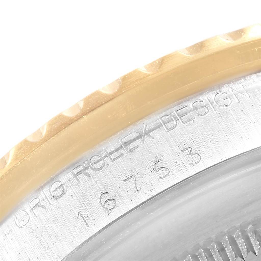 The image shows a close-up view of the serial number and bezel of the Vintage Collection model by Rolex.