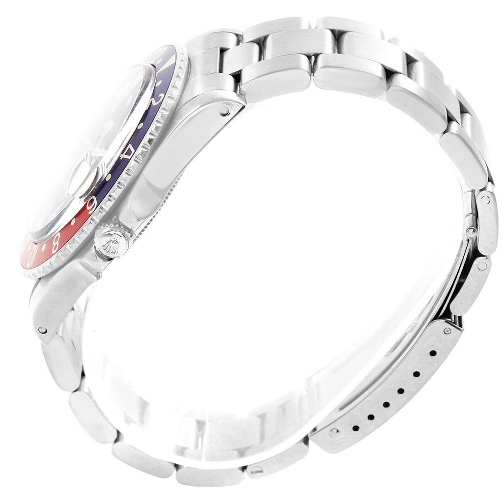 The image shows a side profile view of the Vintage Collection Rolex watch, displaying the bezel, crown, and part of the bracelet.