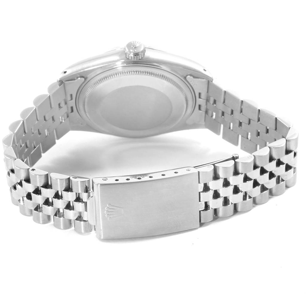 The image shows the back view of a Rolex Vintage Collection 16014 Men
s Stainless Steel Silver Dial 16014 Men
s Stainless Steel Silver Dial watch, highlighting its case, crown, and bracelet clasp.