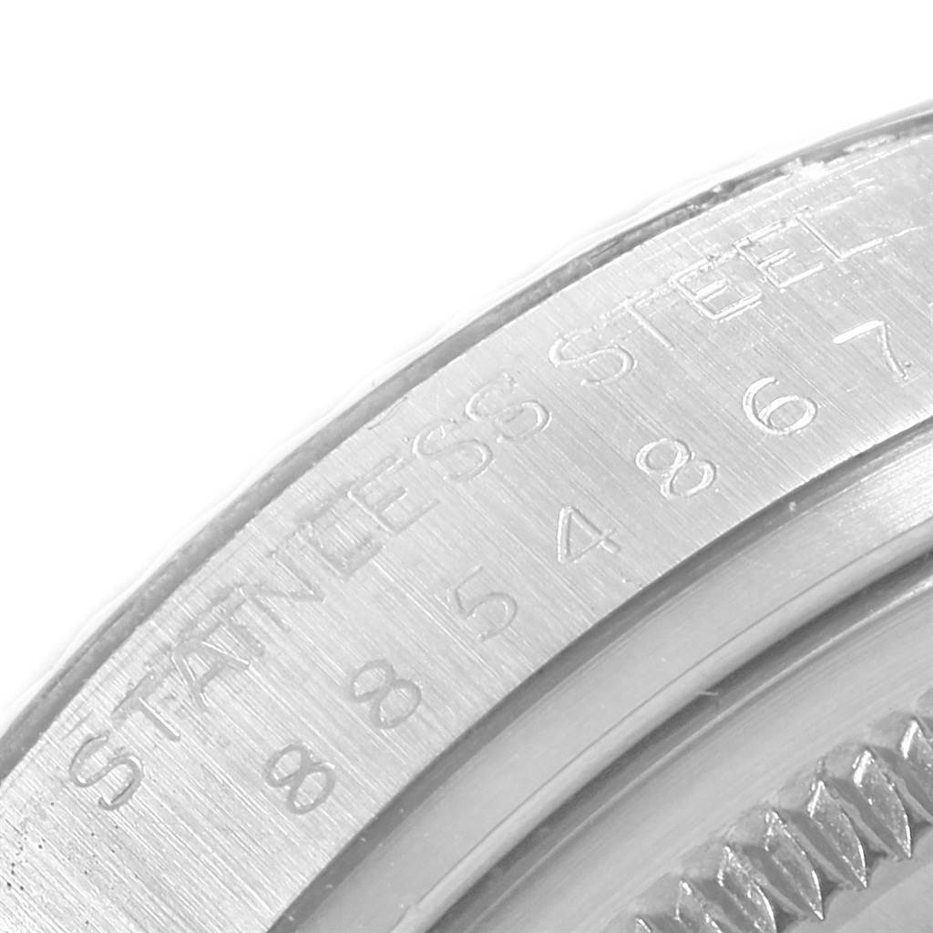 This image shows a close-up angle of the side of a Rolex Vintage Collection 16014 Men
s Stainless Steel Silver Dial 16014 Men
s Stainless Steel Silver Dial watch, highlighting the engraved lettering and part of the bezel.