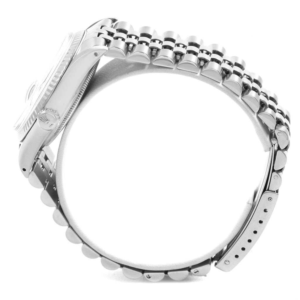 The image shows a side view of a Rolex Vintage Collection 16014 Men
s Stainless Steel Silver Dial 16014 Men
s Stainless Steel Silver Dial watch, highlighting the case, crown, and bracelet.