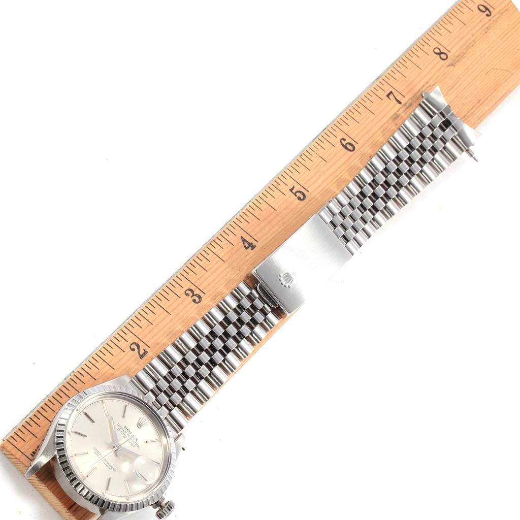 The image shows a flat-lay view of a Rolex Vintage Collection 16030 Men's Stainless Steel Silver Dial 16030 Men's Stainless Steel Silver Dial watch, displaying the face, bracelet, and clasp against a ruler for scale.