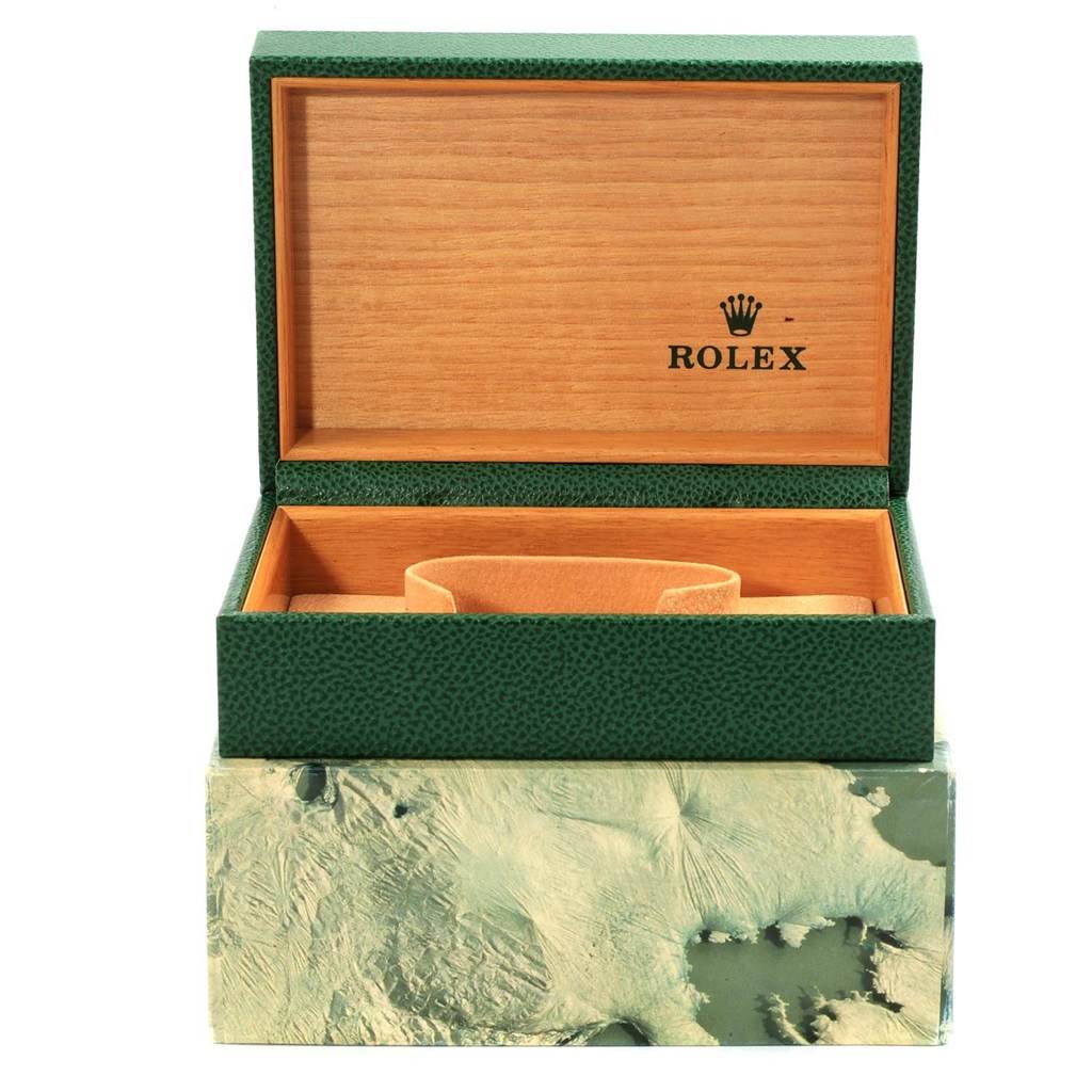 The image shows an open Rolex Vintage Collection 16030 Men's Stainless Steel Silver Dial 16030 Men's Stainless Steel Silver Dial watch box with green exterior and wood-finish interior.