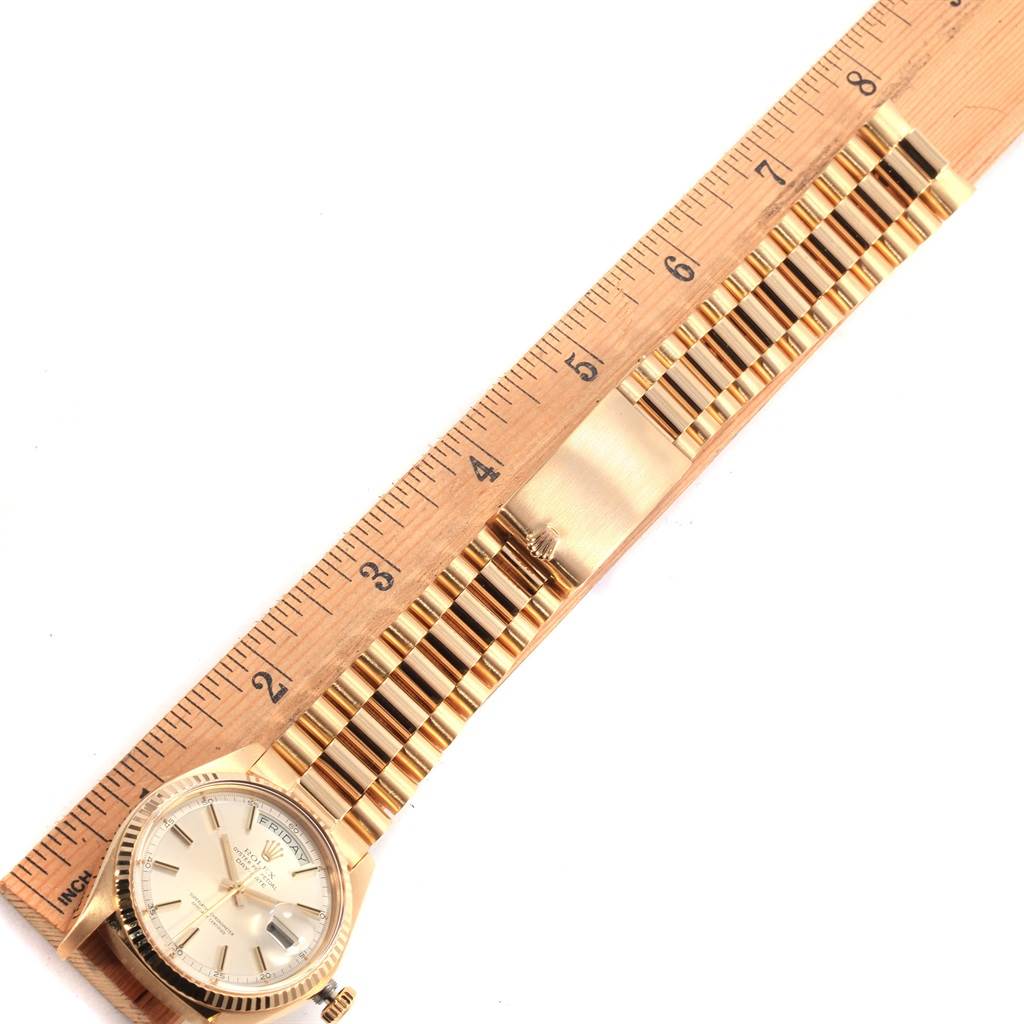 The image shows a top-down view of a Rolex Vintage Collection 1803 Men's Yellow Gold Silver Dial 1803 Men's Yellow Gold Silver Dial watch with the face and full length of the band measured against a ruler.