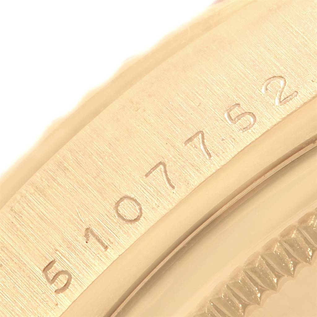 This close-up angle shows the engraved serial number part of a Vintage Collection Rolex watch.
