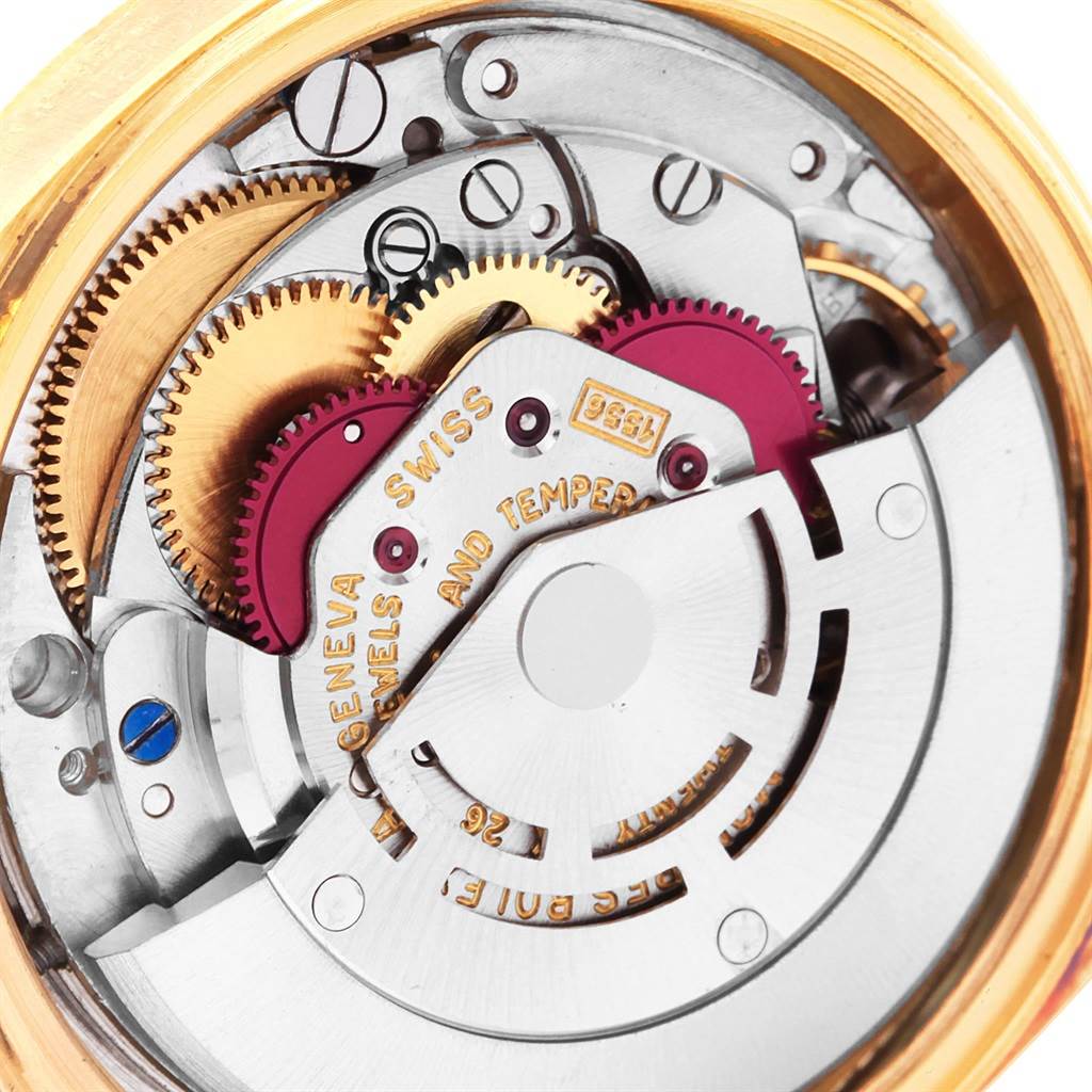 This is a close-up view of the movement of a Rolex Vintage Collection 1806 Men's Yellow Gold Grey Dial 1806 Men's Yellow Gold Grey Dial watch, showcasing gears and intricate internal parts.