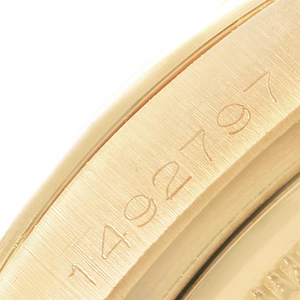This close-up image shows the serial number engraved on the case side of a Rolex Vintage Collection 1806 Men's Yellow Gold Grey Dial 1806 Men's Yellow Gold Grey Dial watch.