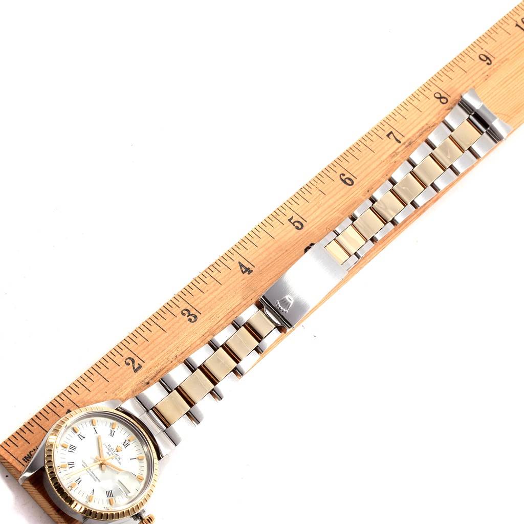 The image shows a Rolex Vintage Collection 1505 Men's Steel and Gold (two tone) White Dial 1505 Men's Steel and Gold (two tone) White Dial watch laid flat with the strap extended alongside a ruler for scale.